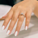 Smooth hand with fresh manicure and engagement ring