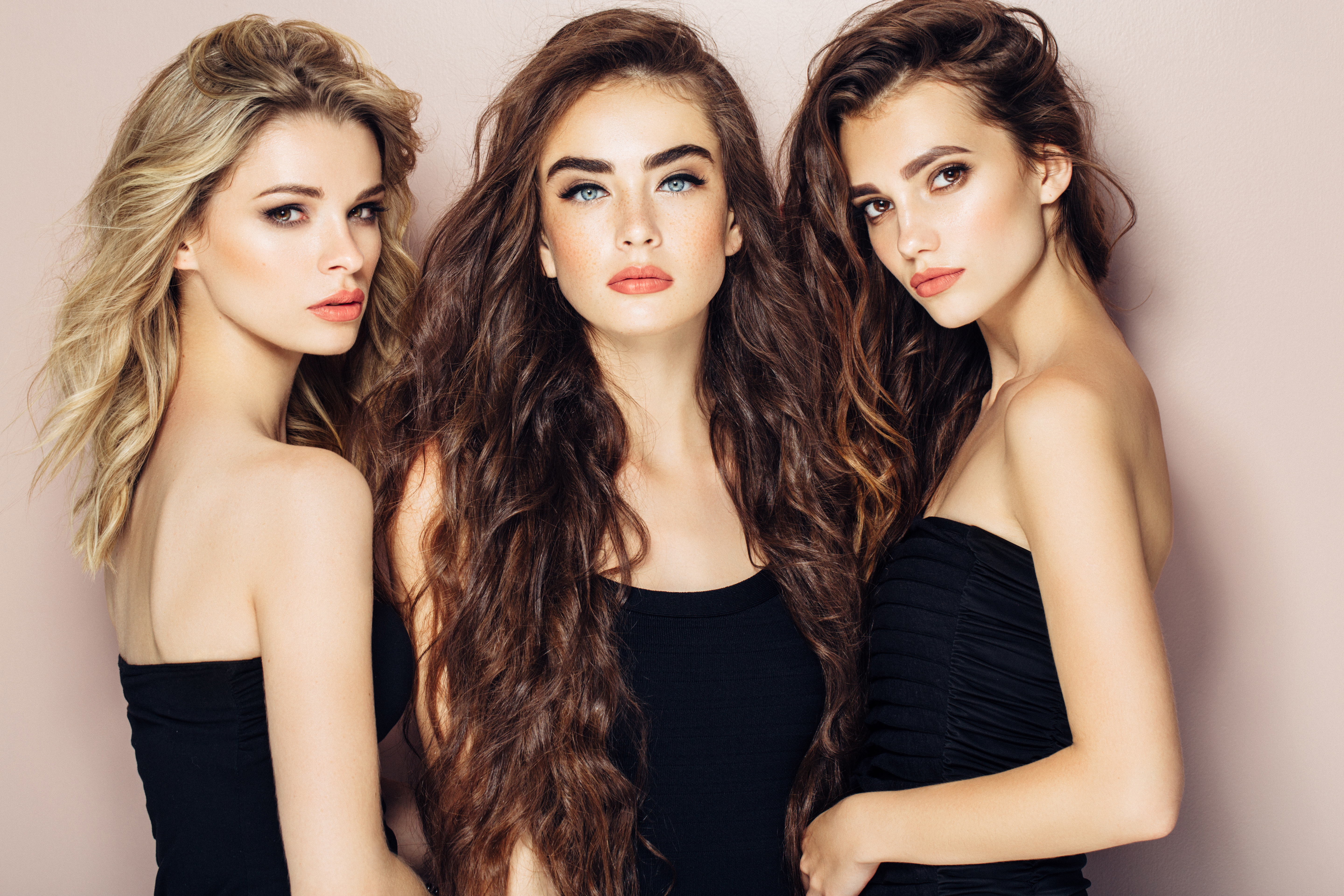 Three beautiful girls with perfect hairstyle and make-up