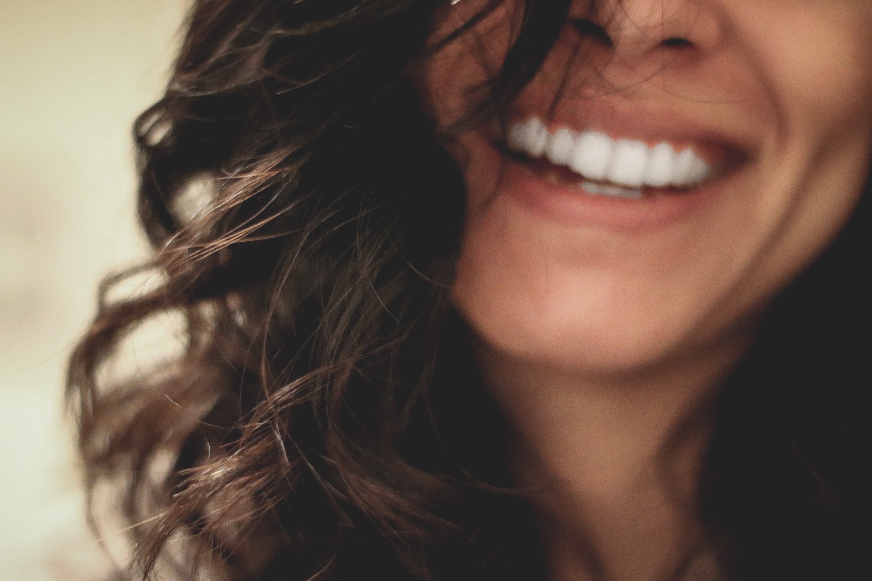 Woman with long dark hair and pretty smile