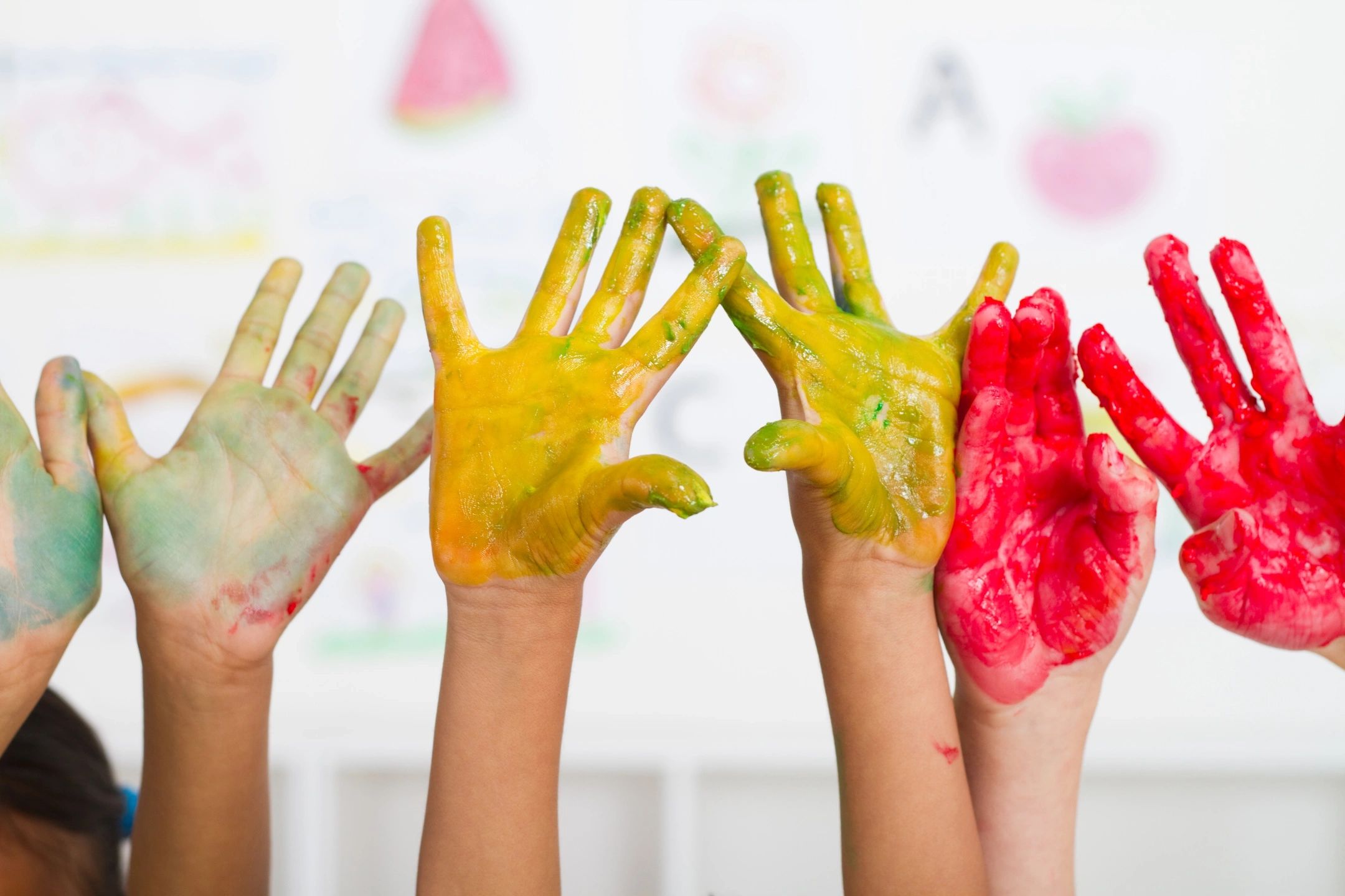 paint covered children's hands